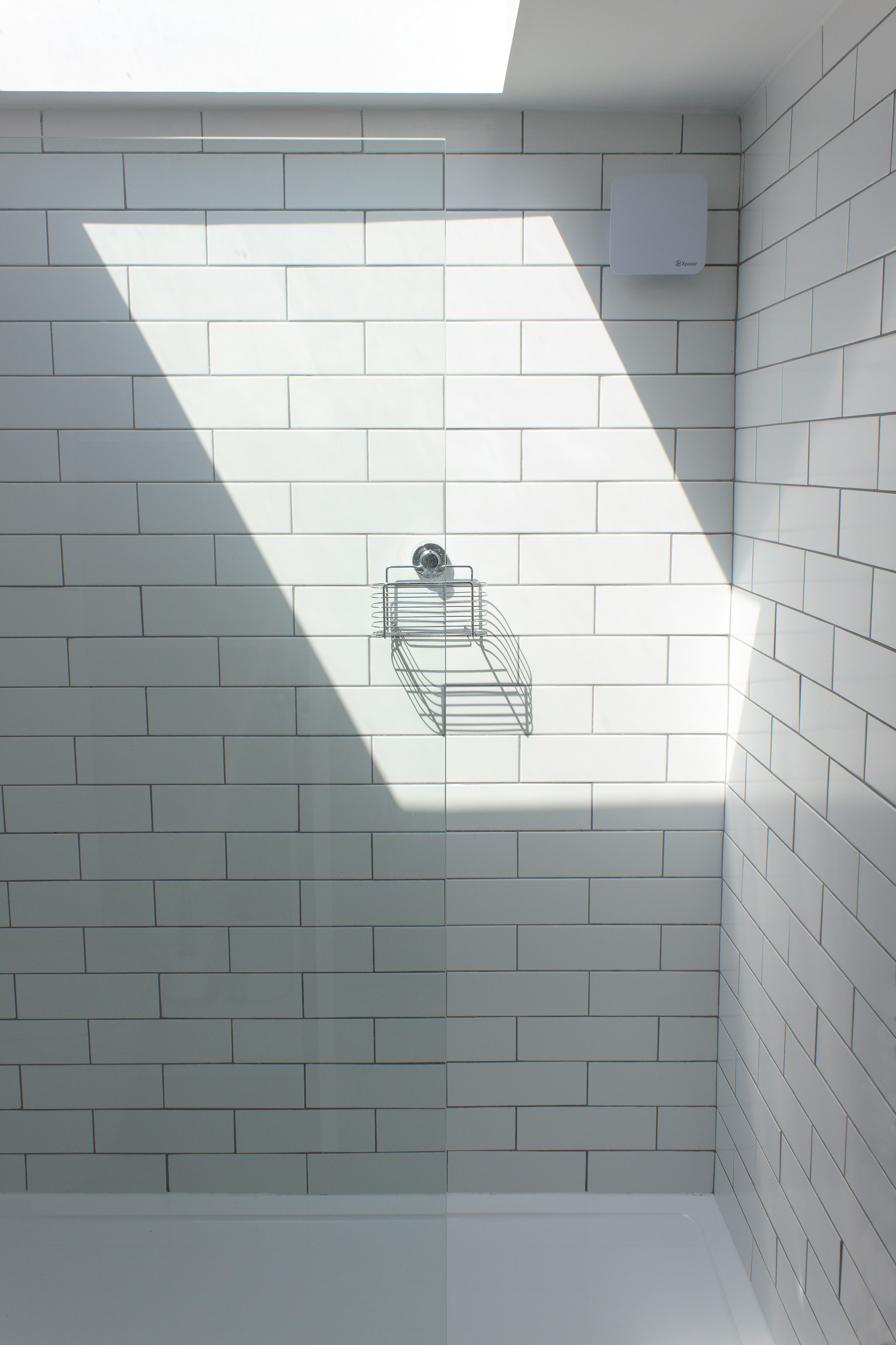 white ceramic bathtub with faucet